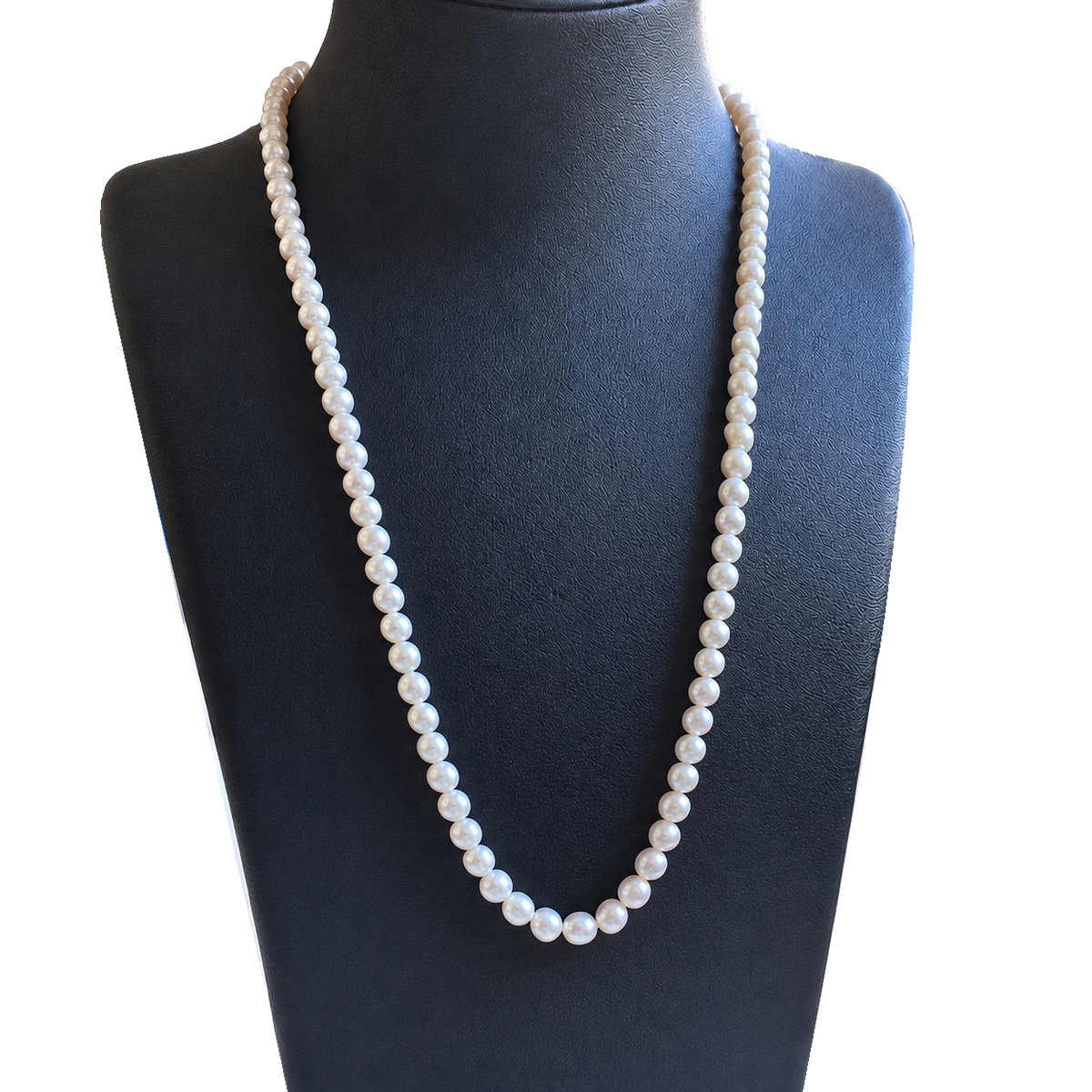 Baby freshwater pearl necklace displayed on a black jewelry bust, front view.