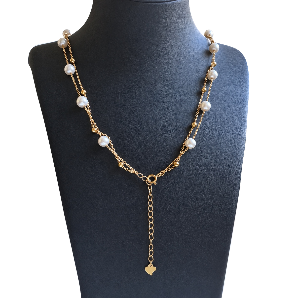 Back view of the YUKI Double Chain freshwater pearl necklace, showing the clasp and extender chain with a heart-shaped charm on a black jewelry bust.
